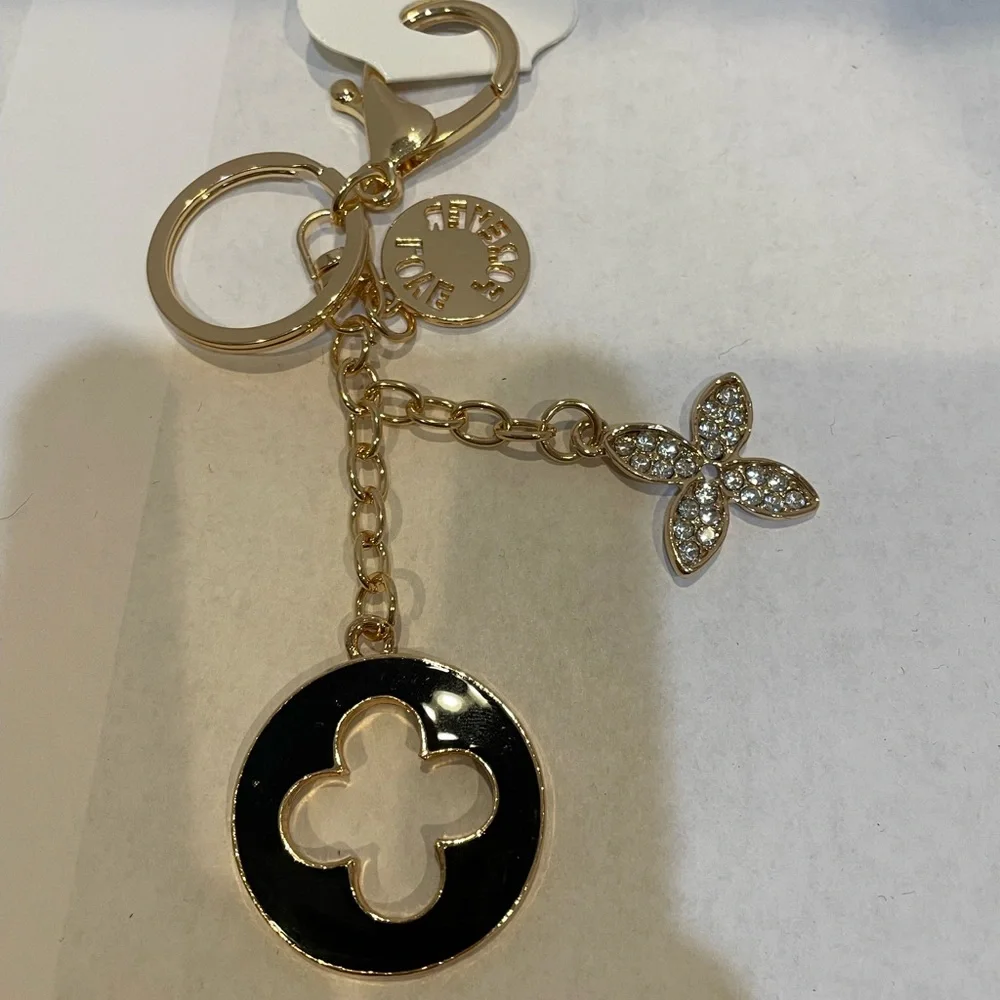 New! Unbranded black enamel clover keychain